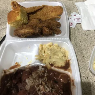 a tray of fried chicken, beans, rice, and beans