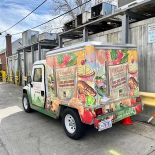 a food truck parked in front of a building