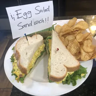 a sandwich and chips on a plate
