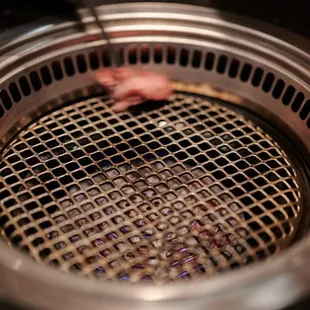 Cleaning the grill with fat