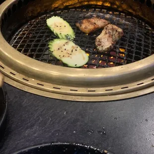 Zucchini, chicken, and pork belly grilling away!