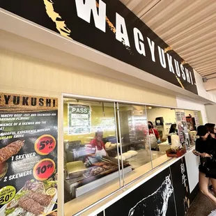 a line of people waiting to order food