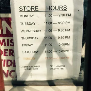 a store hours sign