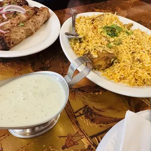 ows two plates of food on a table