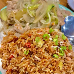 a plate of fried rice and vegetables