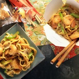 a bowl of noodles and chopsticks