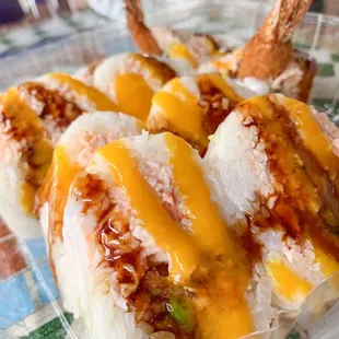 three pieces of sushi wrapped in plastic