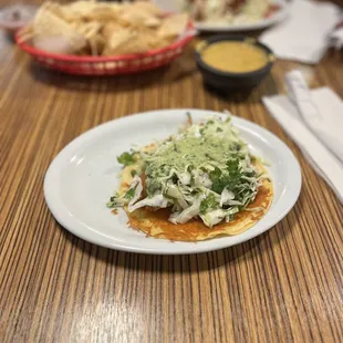 Fried Alaskan pollock taco topped with slaw