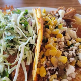 Crispy fish and carnitas tacos