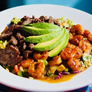 Protein Bowl - banzai veggies, citrus slaw, choice of two proteins topped with fresh Avocado slices