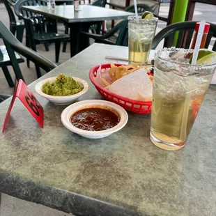 Margaritas and guacamole and chips.