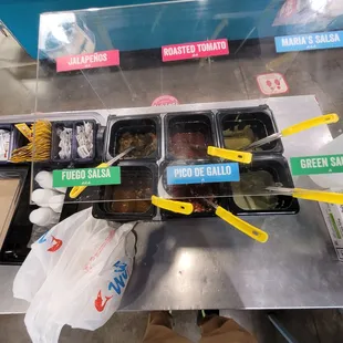 Various Mexican sauces to choose from.