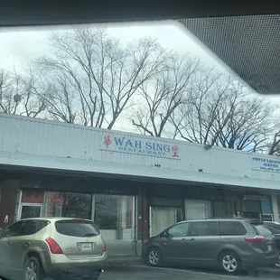 cars parked in front of the restaurant