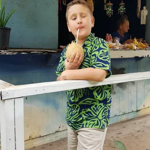 Dalton enjoying his first coconut!