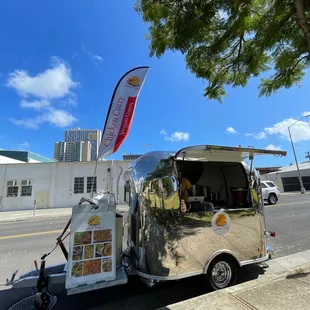 a food truck parked on the side of the road