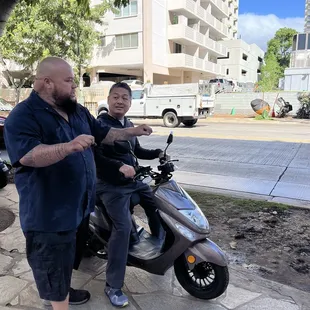 Owner going the extra mile to make sure my husband feels safe during his first moped experience!