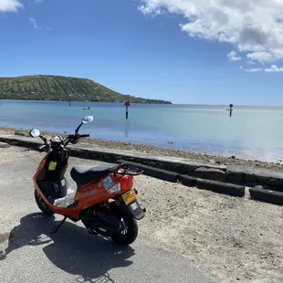 Riding a moped along the coast of Oahu