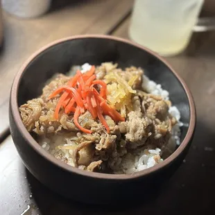 a bowl of rice and meat