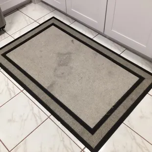 Filthy kitchen rug.