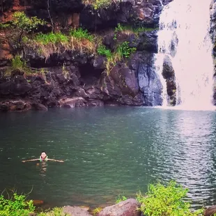 Swimming by the falls.