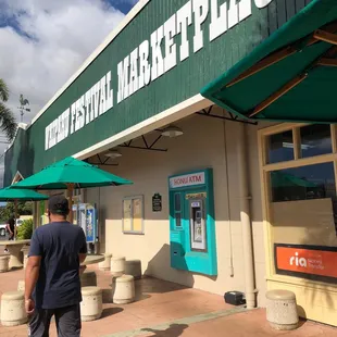 a man walking in front of the store