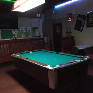 a pool table in a bar
