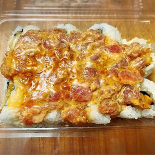 Dynamite maki ( shrimp tempura with spicy ahi on top)