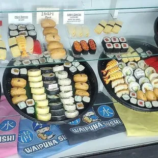 Platters, nigiri and t-shirt display.