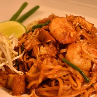a plate of noodles and shrimp