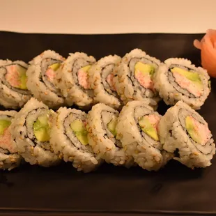 a plate of sushi rolls