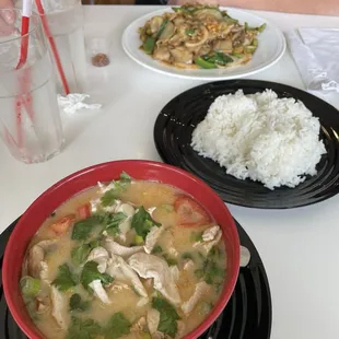 Coconut Milk Soup with Chicken and it comes with a side of rice.