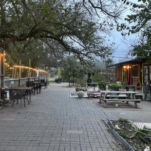 a patio with tables and chairs