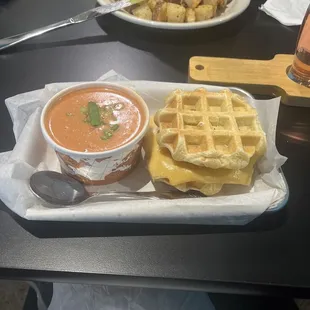 The tomato bisque and triple grilled cheese