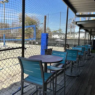 a view of a baseball field through a fence