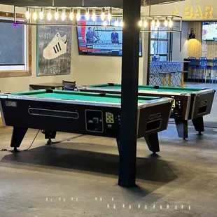 a pool table in a game room