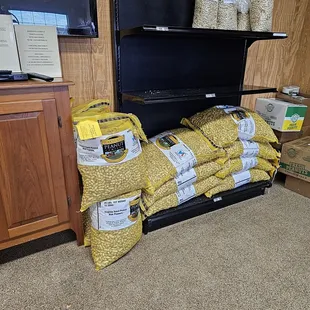 a stack of bags of peanuts