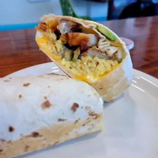 a breakfast burrito on a plate