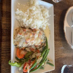 a plate of food with rice and vegetables