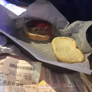 a hamburger and a roll on a table