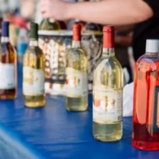 bottles of wine lined up on a table