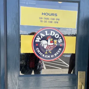 Front door with hours of operation.