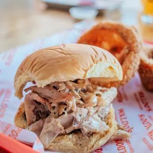 a pulled pork sandwich on a bun