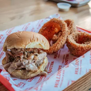 a sandwich and onion rings