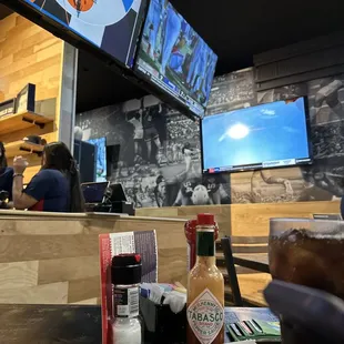 ows a view of the bar and televisions