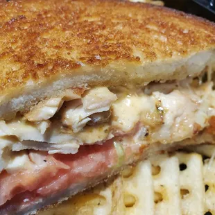 Chicken bomber - shaved chicken breast, pepper jack cheese, tomatoes and spicy mayo. Delicious. Close-up view.