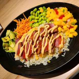 Mango Tuna Bowl - seared ahi tuna, rice, avocado, carrots, edamame, mango salsa, sweet chili, spicy mayo.