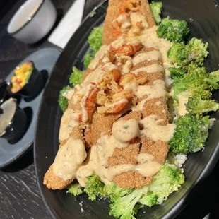 Fried Ragin Red Fish w/ rice broccoli crawfish and crawfish sauce.... Mango salsa too!