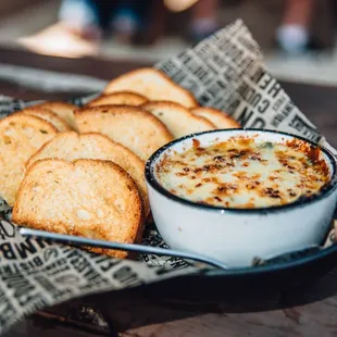 a bowl of cheese and bread