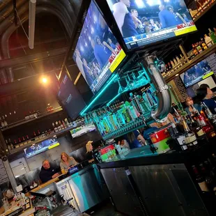 a bar with a large screen tv