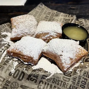 Beignets served with the glaze from the Doughnut Bread Pudding